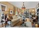 Comfortable living room with hardwood floors, neutral furniture, and charming lighting at 311 3Rd Avenue Se Dr, Hickory, NC 28602