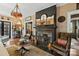 Cozy living room featuring a decorative fireplace, ornate mirror, and unique lighting fixture at 311 3Rd Avenue Se Dr, Hickory, NC 28602