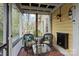 Relaxing screened porch with wicker furniture and a view of the backyard at 311 3Rd Avenue Se Dr, Hickory, NC 28602