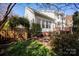 The rear of the home has a sunroom, brick facade, and an enclosed wooden fence at 3329 Brownes Creek Rd, Charlotte, NC 28269