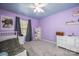 Cheerful purple bedroom with ample storage, a ceiling fan, and plenty of natural light at 3329 Brownes Creek Rd, Charlotte, NC 28269