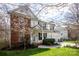 Attractive two-story home with brick and siding, a manicured lawn, and a blossoming tree at 3329 Brownes Creek Rd, Charlotte, NC 28269