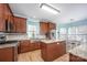 Well-lit kitchen with custom cabinets, stainless steel appliances, granite countertops, and hardwood floors at 3329 Brownes Creek Rd, Charlotte, NC 28269