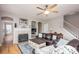 Cozy living room featuring a fireplace, hardwood floors, and lots of natural light at 3329 Brownes Creek Rd, Charlotte, NC 28269