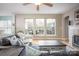 Bright living room with natural light, fireplace, and comfortable seating at 3329 Brownes Creek Rd, Charlotte, NC 28269