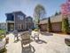 Spacious backyard patio featuring stone pavers, ample seating, and outdoor dining area at 371 Montibello Dr, Mooresville, NC 28117