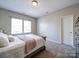 Bright bedroom with a large window and neutral carpet creates a serene retreat at 371 Montibello Dr, Mooresville, NC 28117
