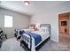 Cozy bedroom features two twin beds and a doorway to another room at 371 Montibello Dr, Mooresville, NC 28117