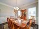Formal dining room with hardwood floors, stylish chandelier, and wainscoting at 371 Montibello Dr, Mooresville, NC 28117