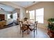 Cozy dining room area with natural light and views of the backyard at 371 Montibello Dr, Mooresville, NC 28117