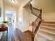 Inviting entryway with hardwood floors, stairs, and access to other living areas at 371 Montibello Dr, Mooresville, NC 28117