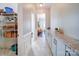 Hallway with custom cabinets and shelving for ample storage at 371 Montibello Dr, Mooresville, NC 28117