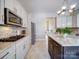 Well-equipped kitchen with stainless appliances and beautiful granite countertops at 371 Montibello Dr, Mooresville, NC 28117