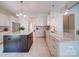 Spacious kitchen with granite countertops, stainless steel appliances, and ample cabinet space at 371 Montibello Dr, Mooresville, NC 28117