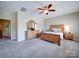 Spacious main bedroom featuring a ceiling fan, wooden furniture, and neutral decor at 371 Montibello Dr, Mooresville, NC 28117