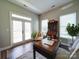 Office featuring hardwood floors, a desk, a decorative cabinet, and lots of light at 371 Montibello Dr, Mooresville, NC 28117