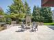 Cozy backyard patio featuring an outdoor fireplace, providing a relaxing space at 371 Montibello Dr, Mooresville, NC 28117