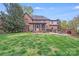Expansive brick home with a screened porch, brick patio, and lush green lawn at 3716 Drayton Hall Ln, Charlotte, NC 28270