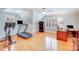 This bonus room is a fitness room and home office that features a treadmill, desk, and safe at 3716 Drayton Hall Ln, Charlotte, NC 28270