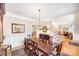 Formal dining room with hardwood floors, chandelier, and wainscoting at 3716 Drayton Hall Ln, Charlotte, NC 28270