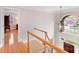 Bright entryway with a chandelier, a large arched window, hardwood floors, and an open doorway to another room at 3716 Drayton Hall Ln, Charlotte, NC 28270