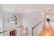 Bright foyer with hardwood and carpeted floors, large windows, and a decorative chandelier at 3716 Drayton Hall Ln, Charlotte, NC 28270