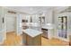 Bright kitchen featuring white cabinets, stainless steel appliances, and center island at 3716 Drayton Hall Ln, Charlotte, NC 28270