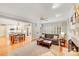 Open concept living area with hardwood floors, fireplace, and seamless flow to the kitchen, great for modern living at 3716 Drayton Hall Ln, Charlotte, NC 28270