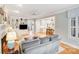 Stylish living room with built-in shelves, fireplace, hardwood floors, and open layout to kitchen, ideal for entertaining at 3716 Drayton Hall Ln, Charlotte, NC 28270
