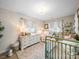 Cozy Bedroom with dual vintage-style cribs, a dresser used as changing table, and soft lighting at 404 Plaza Dr, Harrisburg, NC 28075
