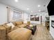 Bright living room with large windows, comfortable seating, and stylish interior decor at 404 Plaza Dr, Harrisburg, NC 28075