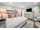 Comfortable bedroom with natural light, decorative pillows, and a dresser with modern decor at 404 Plaza Dr, Harrisburg, NC 28075
