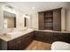 Bathroom with double sinks, beautiful cabinetry, granite countertops, and a built-in storage unit at 4421 3Rd Nw St, Hickory, NC 28601