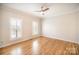 Bedroom with hardwood floors and two windows at 4421 3Rd Nw St, Hickory, NC 28601