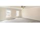 Spacious bedroom with wall-to-wall carpeting, two windows offering natural light and neutral paint at 4421 3Rd Nw St, Hickory, NC 28601