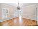 Dining room featuring hardwood floors and modern chandelier at 4421 3Rd Nw St, Hickory, NC 28601