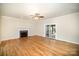 Living room featuring hardwood floors, a fireplace, and plenty of natural light at 4421 3Rd Nw St, Hickory, NC 28601