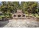 An inviting outdoor stone fireplace with wood storage on a flagstone patio at 4421 3Rd Nw St, Hickory, NC 28601