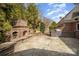 The outdoor kitchen features a stone fireplace and built-in grill on the flagstone patio at 4421 3Rd Nw St, Hickory, NC 28601