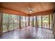 This spacious sun room has windows that overlook the yard with walls painted a dark color at 4421 3Rd Nw St, Hickory, NC 28601