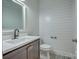 Modern half bath featuring shiplap walls, floating vanity, and sleek fixtures at 508 Standpipe Hl, Cramerton, NC 28032