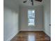 Cozy bedroom with hardwood floors and a window offering a view of the neighborhood at 508 Standpipe Hl, Cramerton, NC 28032