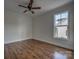 Bright bedroom with hardwood floors and a window overlooking the backyard at 508 Standpipe Hl, Cramerton, NC 28032