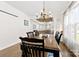 Dining room boasts a wooden table, dark wood floors, an decorative ceiling, and plenty of natural light at 508 Standpipe Hl, Cramerton, NC 28032