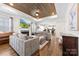 The living room with a beautiful fireplace, wooden ceiling, hardwood floors, and a comfortable sofa at 508 Standpipe Hl, Cramerton, NC 28032