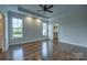 Spacious main bedroom featuring hardwood floors, tray ceiling and ensuite bathroom entrance at 508 Standpipe Hl, Cramerton, NC 28032