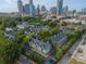 An aerial view of the community with the downtown city skyline in the distance at 513 N Graham St # 3H, Charlotte, NC 28202