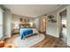 Warm bedroom features modern decor, including a colorful bedspread and an artistic rug at 513 N Graham St # 3H, Charlotte, NC 28202
