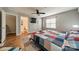 Well-lit bedroom featuring hardwood floors, a ceiling fan, and an ensuite bathroom at 513 N Graham St # 3H, Charlotte, NC 28202