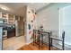 View of the dining room area with wall decor and bar stool seating at 513 N Graham St # 3H, Charlotte, NC 28202